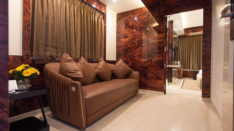brown sofa placed in the Executive Suite at Hotel Park Elanza, Coimbatore