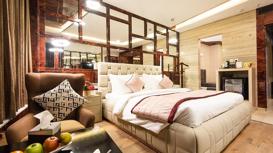 The view of Executive Suite featuring a bed and sofa by its side at Hotel Park Elanza, Coimbatore