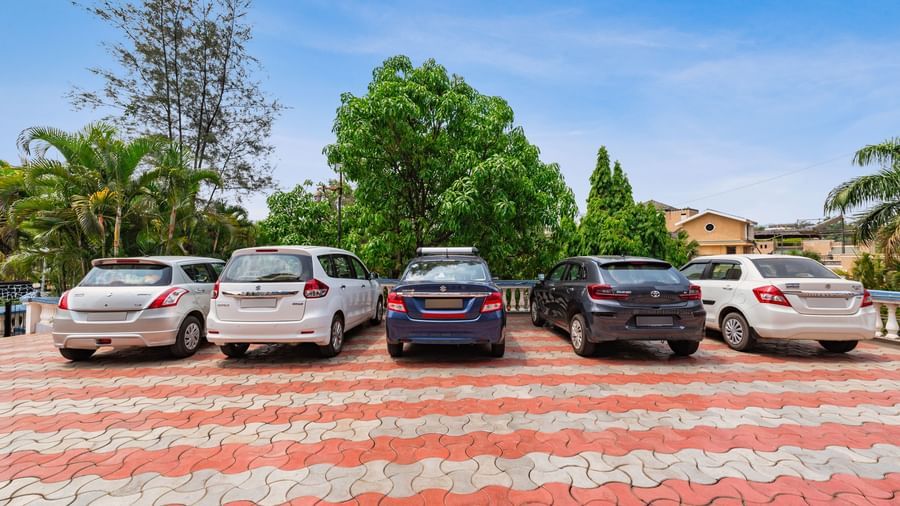 Cars parked next to each other in a parking slot at Mayur Resort.