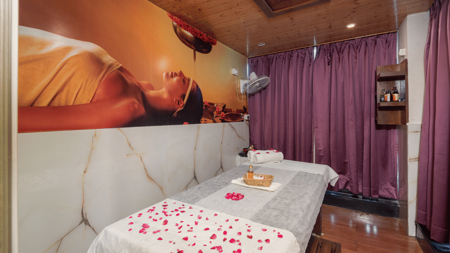 Spa treatment bed with fresh flowers at DLS Hotels On The Ganges.