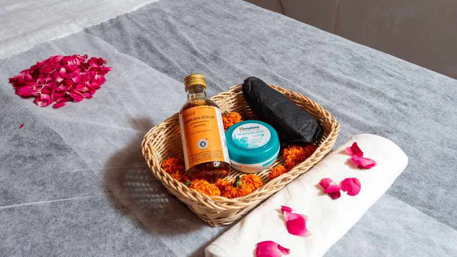 Spa table with oils and flowers at DLS Hotels On The Ganges.