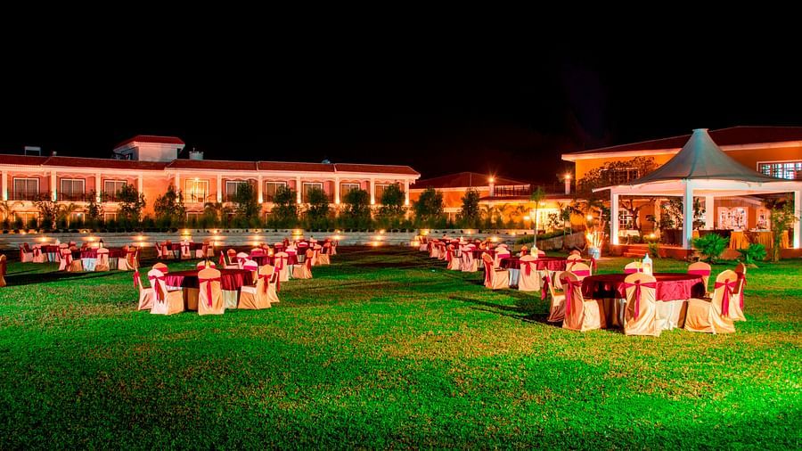 Seating arrangement in the lawn at Swosti Chilika Resort at night