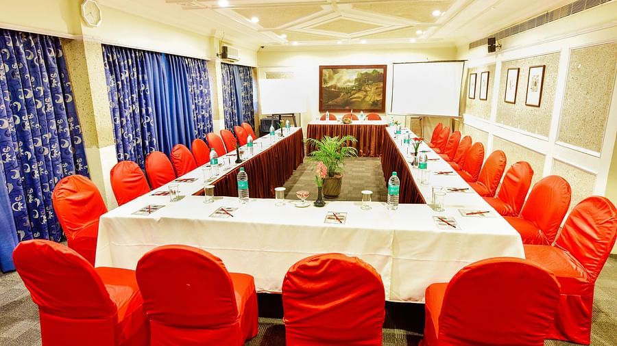 Image of mini banquet hall with table an chairs at Swosti Grand, Bhubaneswar