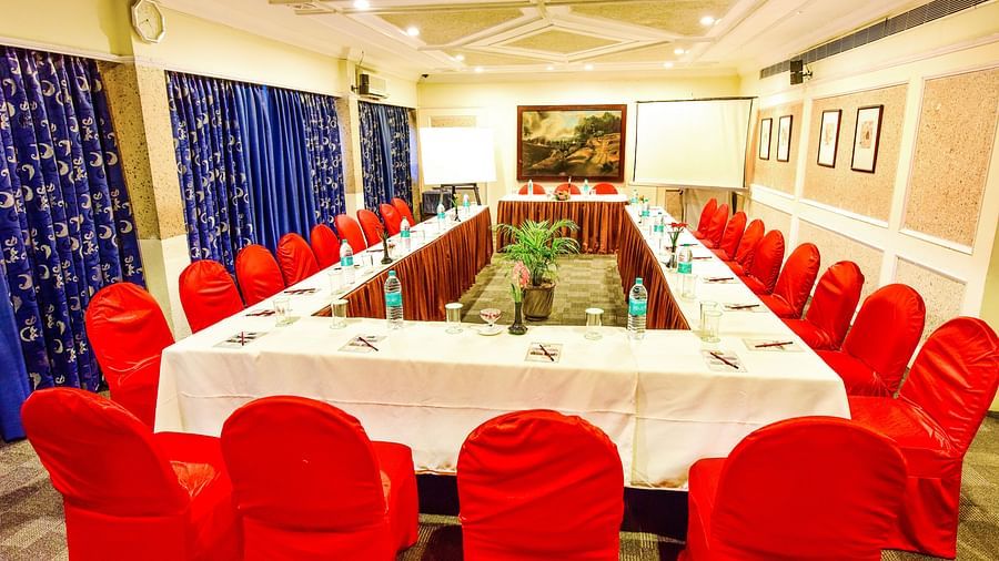 Image of mini banquet hall with table an chairs at Swosti Grand, Bhubaneswar