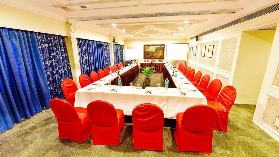 Image of mini banquet hall with table an chairs at Swosti Grand, Bhubaneswar