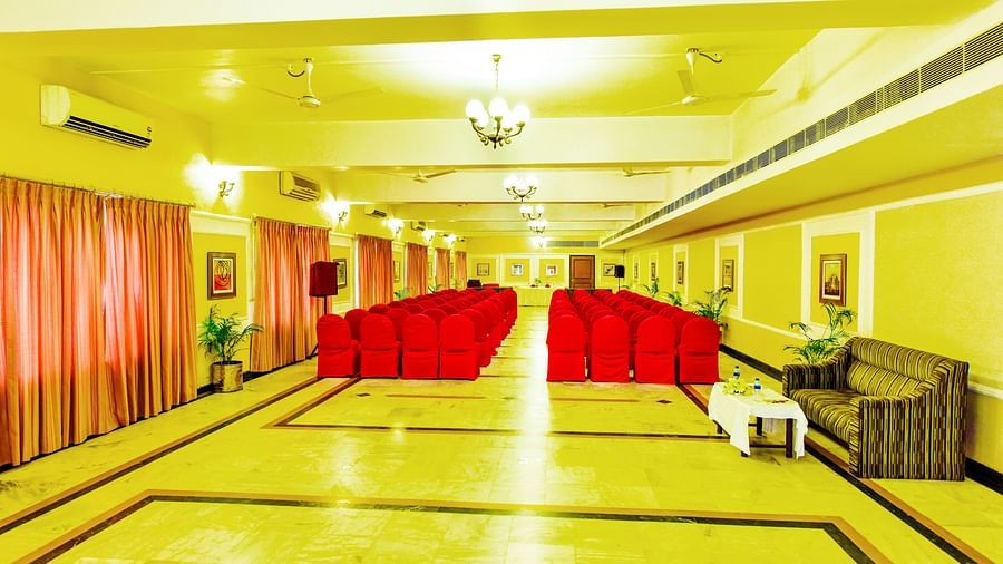Banquet hall brightly lit and adorned with decorations throughout, perfectly set up for celebrations.