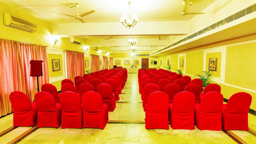 Banquet hall brightly lit and adorned with decorations throughout, perfectly set up for celebrations.