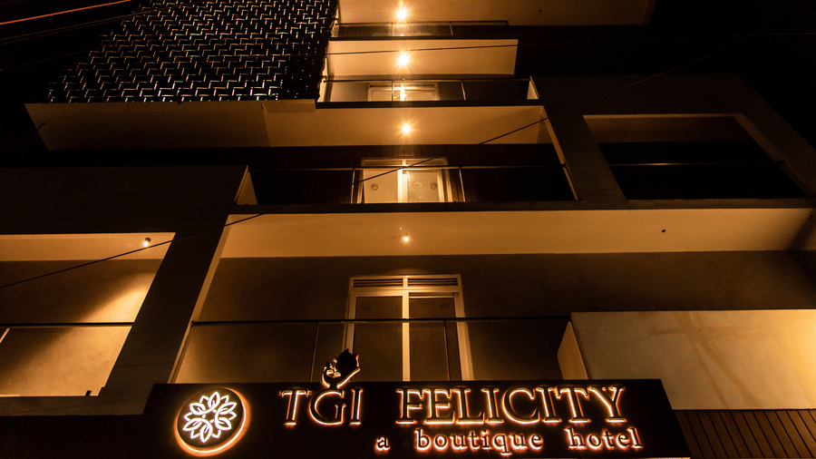 Exterior of TGI Felicity, Begur Hobli, Bangalore with warm lighting at night view.