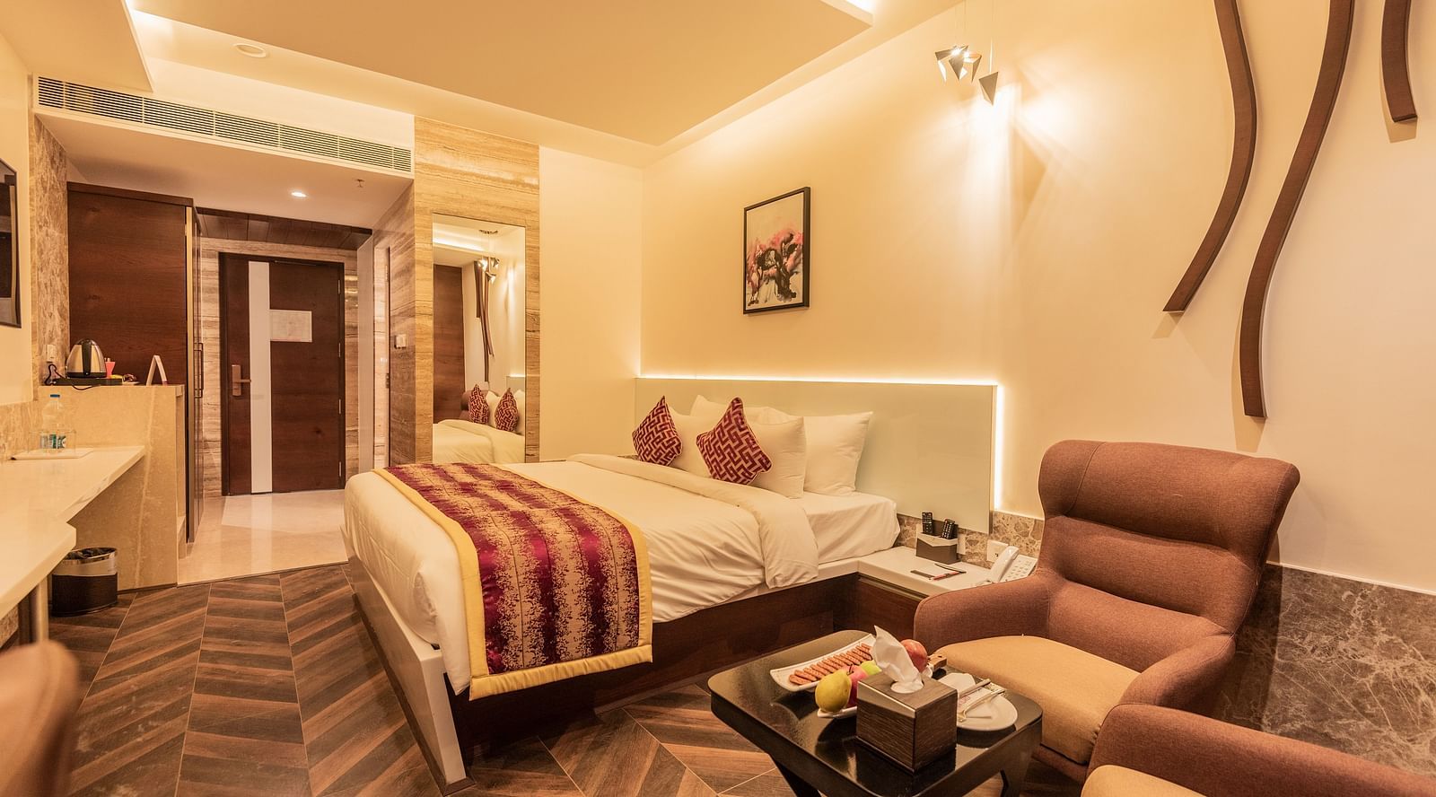 Club Room featuring a bed, sofa and a table at Hotel Park Elanza, Coimbatore