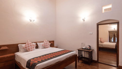 A view of the Mayfair Suite Main Bedroom with a double bed - Ibex Resort, Coonoor (Leewood).