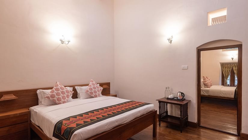 A view of the Mayfair Suite Main Bedroom with a double bed - Ibex Stays & Trails, Coonoor (Leewood).
