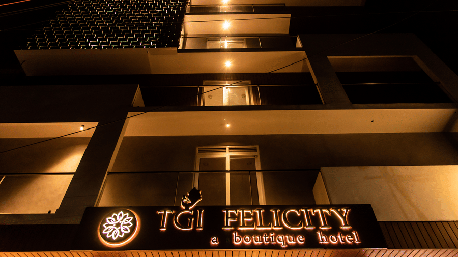 Exterior of TGI Felicity, Begur Hobli, Bangalore with warm lighting at night view.