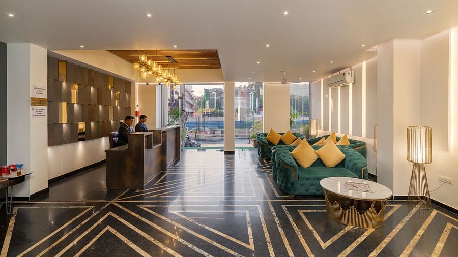 The reception and waiting area of DLS Ganga Bliss, Haridwar with bright lighting