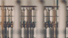 a close up shot of threads being woven into usable threads