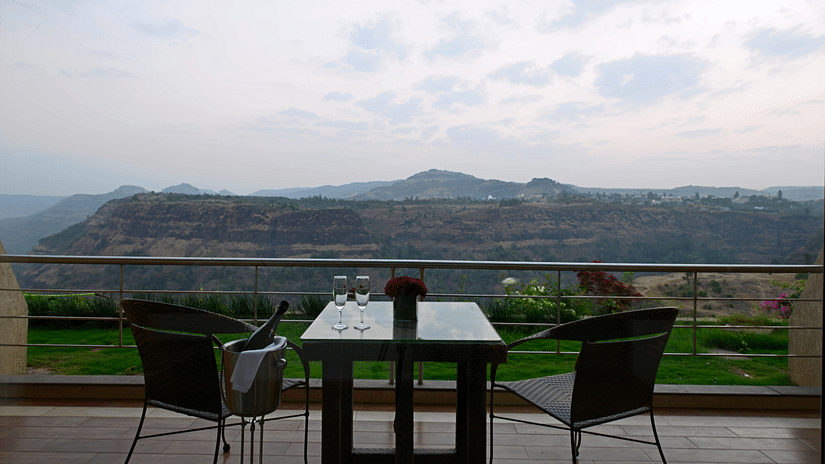 an outdoor seating area overlooking the mountains from a balcony - The Dukes Retreat, Khandala