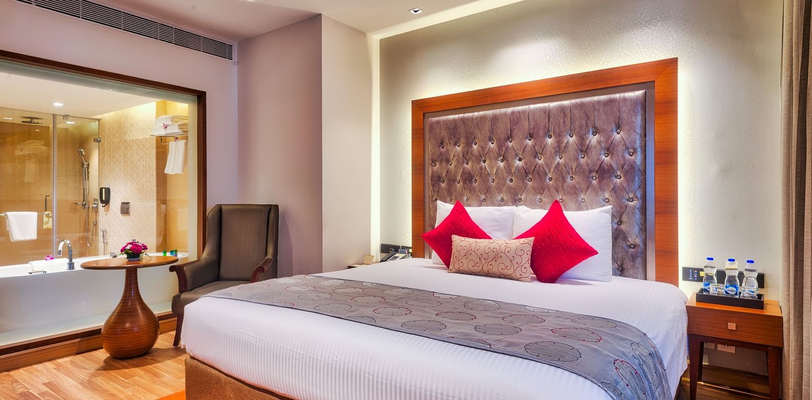 Deluxe Suite with a king size bed at Grand Chennai By GRT Hotels.