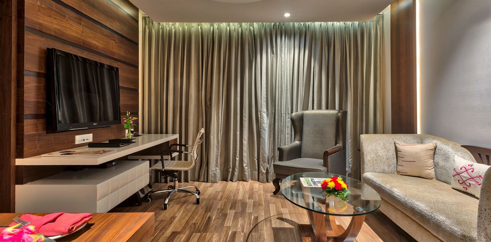 Living Room of Deluxe Suite at Grand Chennai By GRT Hotels.