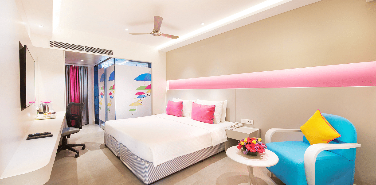 side view of a bedroom with a sofa at  Zibe Salem by GRT Hotels