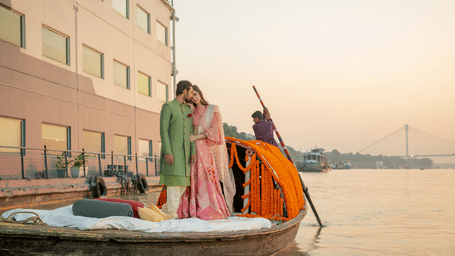 A newly wed standing on a beautifully decorated boat - polo floatel kolkata