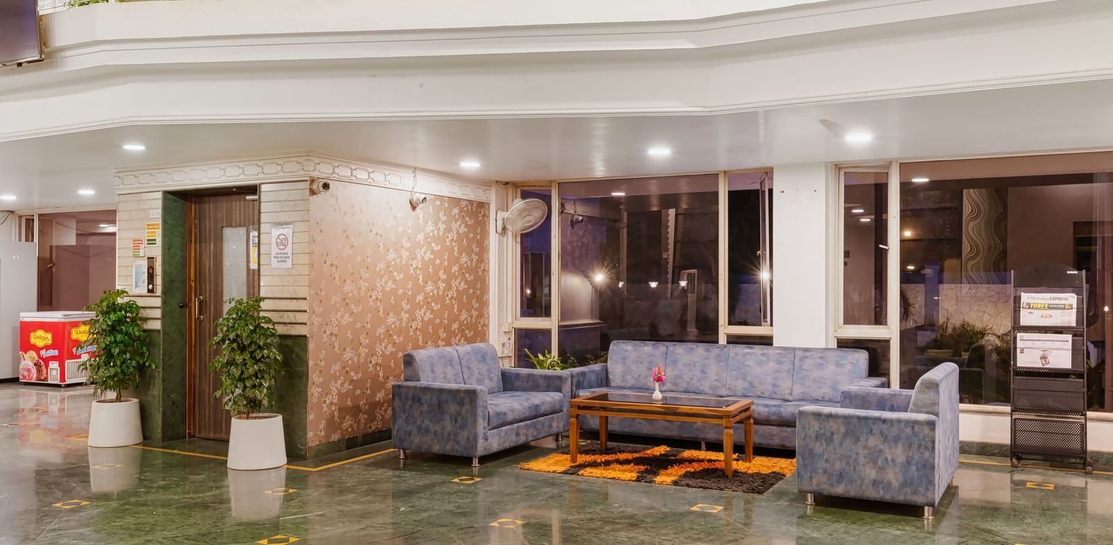 Mayur Retreat lobby area featuring sofas, a coffee table with modern interiors.