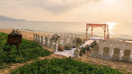 The wedding venue on the beach overlooking the ocean with a beautiful sunset in the background - Maikhao Dream Villa Resort & Spa, Phuket