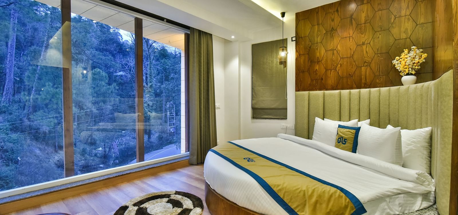 elegant interiors of the honeymoon suite at DLS Ark Holiday Inn with beautiful views from huge glass windows