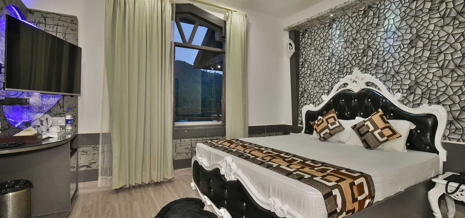 A Luxury Room at DLS Dalhousie  Valley Resort with a premium bed and balcony