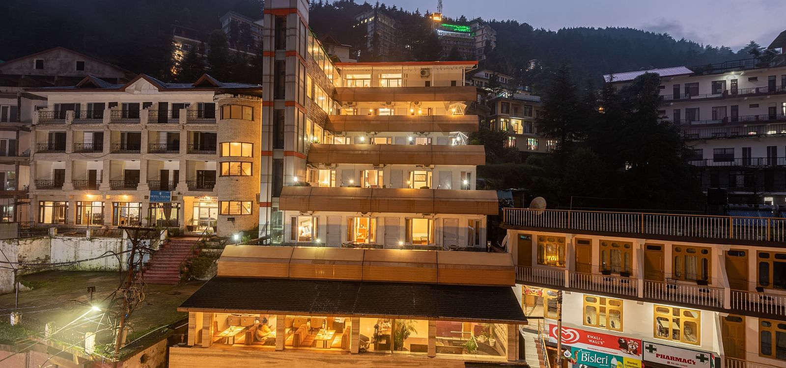 Exterior facade view of DLS Spring Valley Resort Dharamshala during night