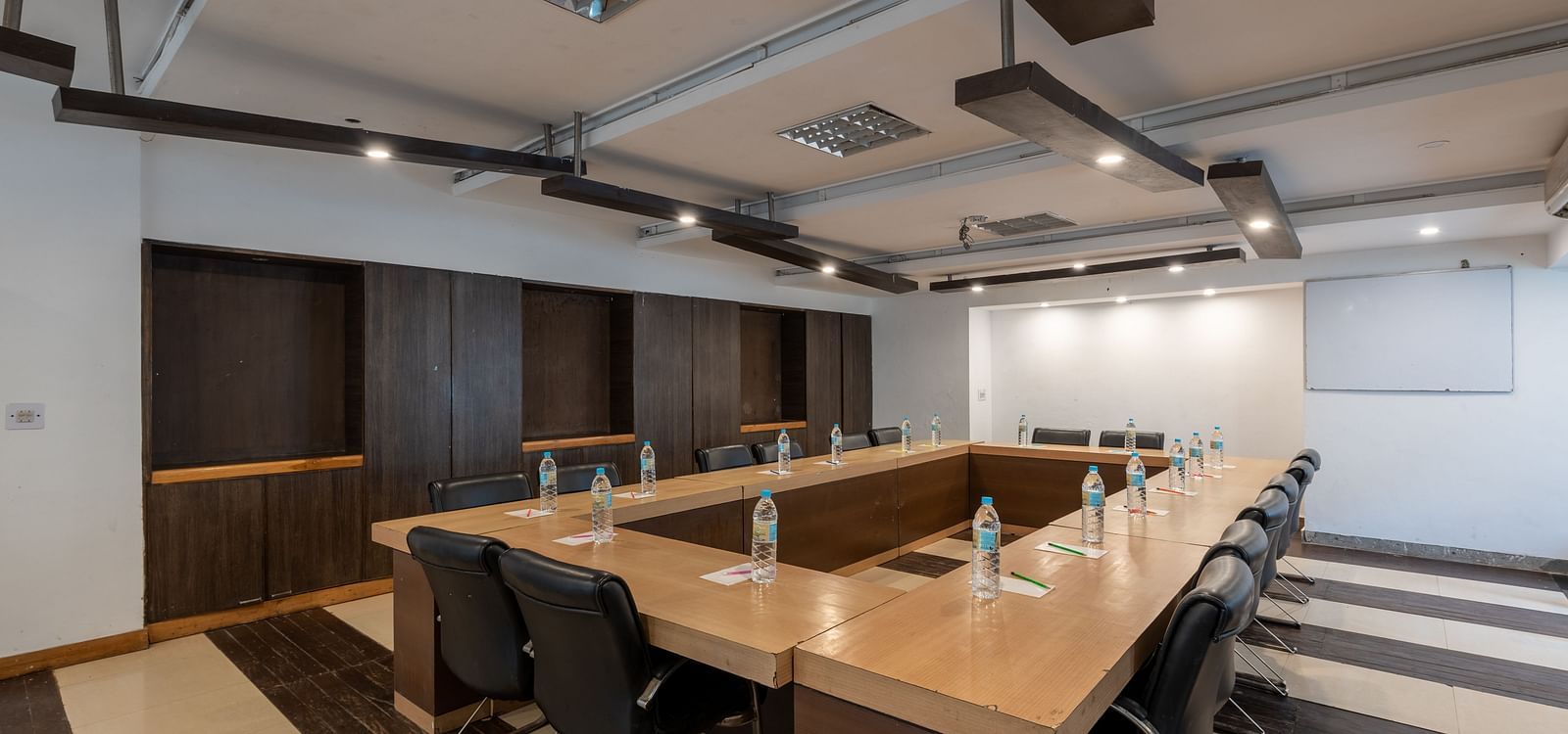 Overview of Conference Hall  at DLS Spring Valley Resort Dharamshala  with chairs and tables arranged in boardroom setting 