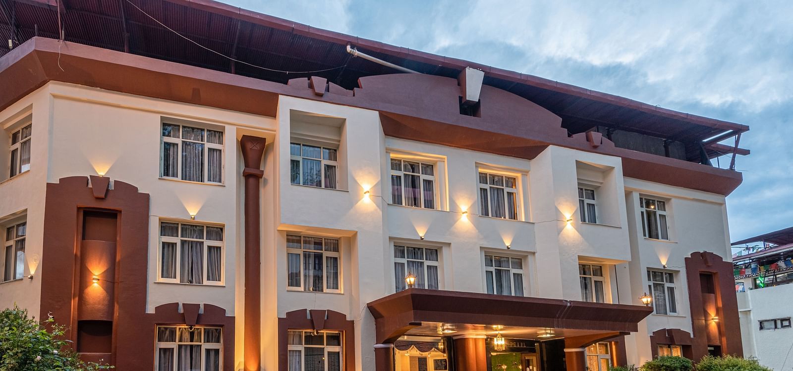 Shot of the facade of the hotel with sky in the background | DLS The Pearl