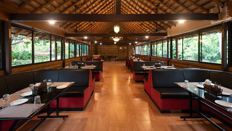 an overview of Aqua Restaurant at Ibex River Resort, Pollachi