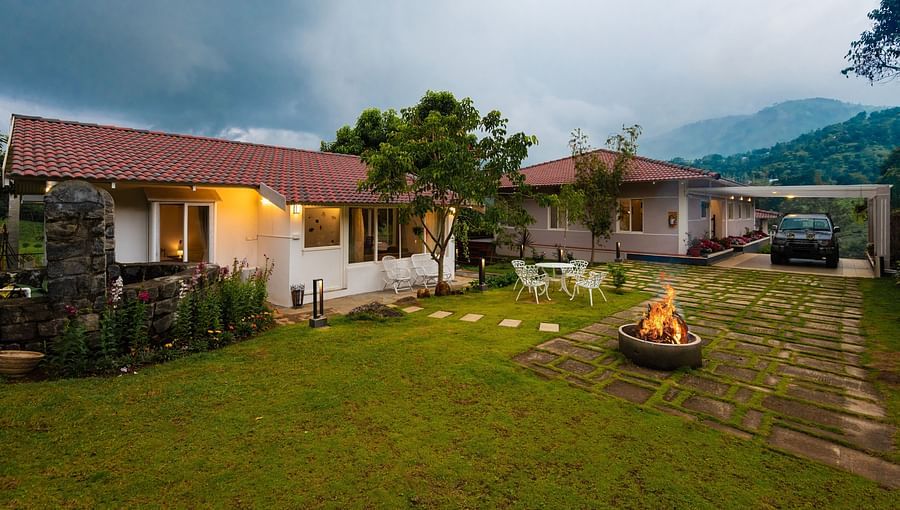 alt-text Annexe and Main House Exterior with out seating and campfire - Ibex Stays & Trails, Kotagiri