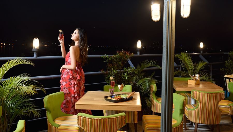 a girl looking at stars from the outside deck  - polo floatel kolkata