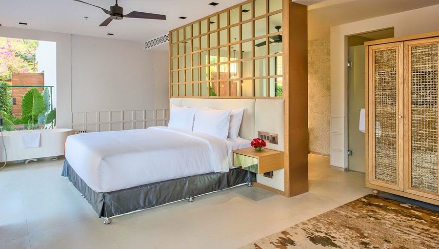 alt-text Bedroom with pale gold tones and white bed cover