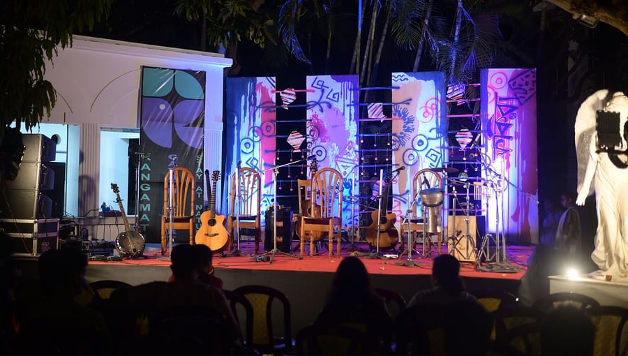 Event place at Rangamati Garden Resort featuring stage lighting, a stage, musical instruments , and a statue.