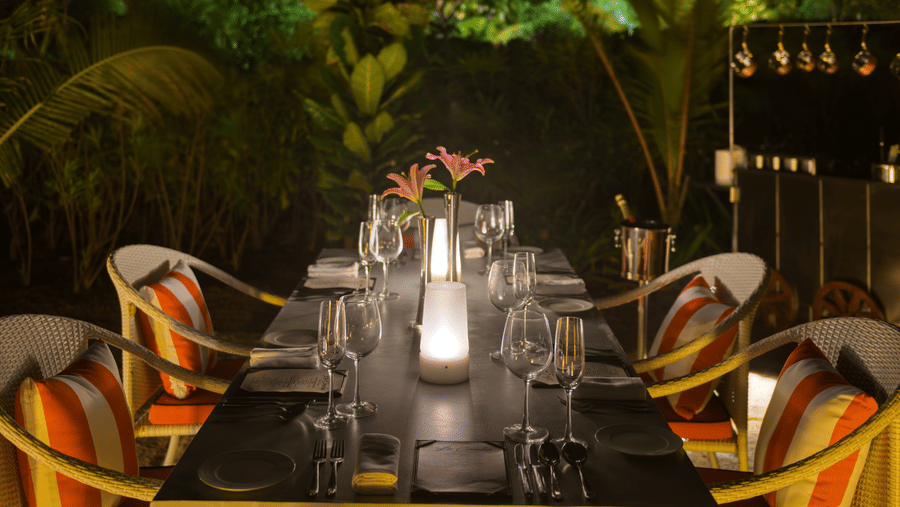 A table for 4 guests in an outdoor setting of La Concha set for a cosy intimate diner at Azaya Beach Resort, Goa.