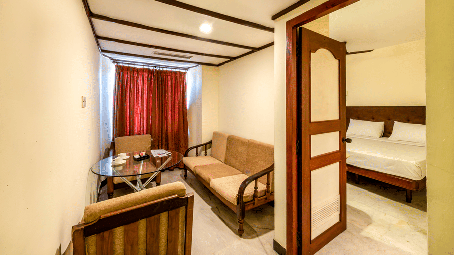 Spacious suite at Jayaram Hotel, Pondicherry with separate living and sleeping areas for a comfortable stay.