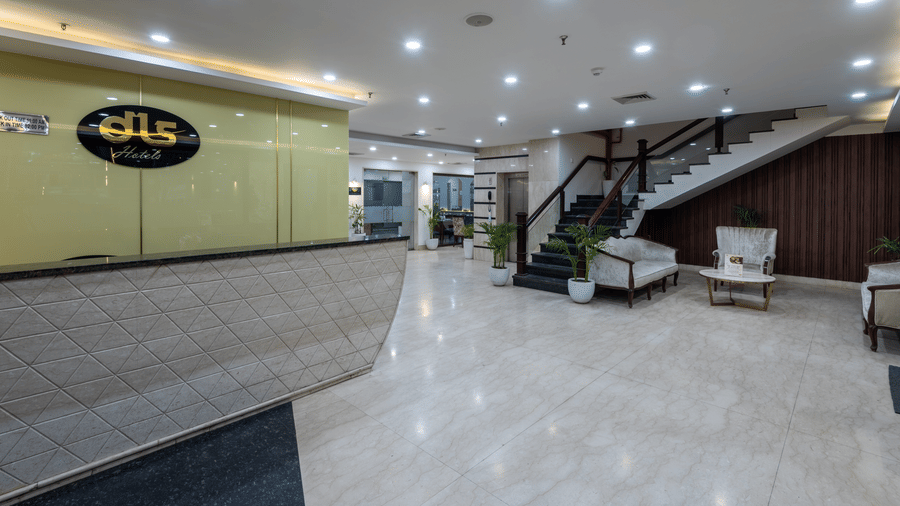 Side view of the reception area with a staircase leading upward at DLS The Classio