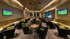 An image of the bar at the Pride Elite Phaltan with its seating arrangement and decorative lighting