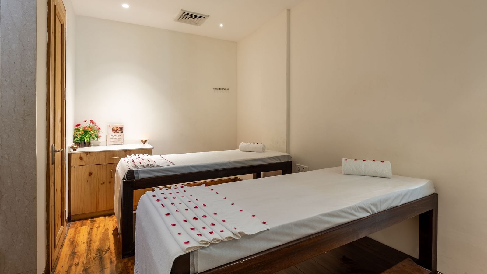 side view of spa beds decorated with rose petals at DLS The Classio