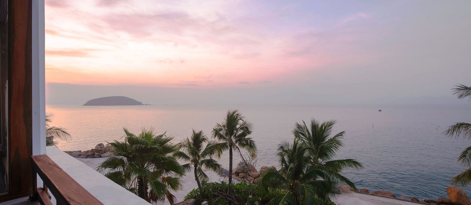 Another view of palm trees near a sea seen during a sunset through our balcony - Alibu Resort Nha Trang