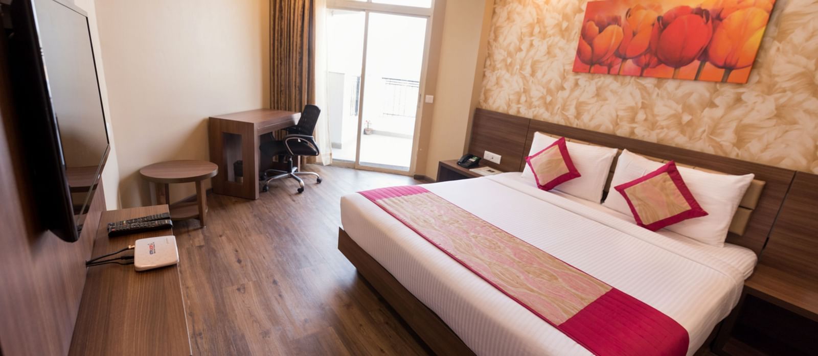 Suites Room with Complimentary Wi-Fi in a hotel room with separate living room that features a couch and a separate bedroom with a queen size bed - Le ROI Digha Hotel West Bengal9