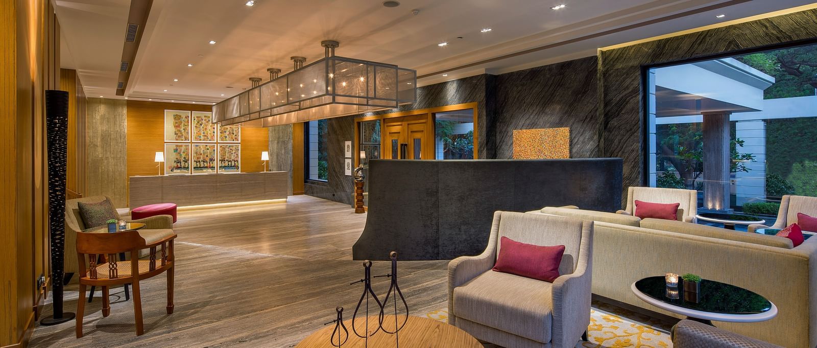 Image of a Lobby sitting area at The Raintree St. Mary s Road with high ceiling and chic decor