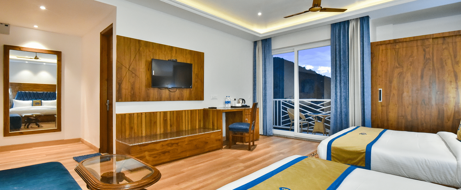 View from two large beds in front of TV in Family Suite Room at DLS Ark Holiday Inn, Banikhet.