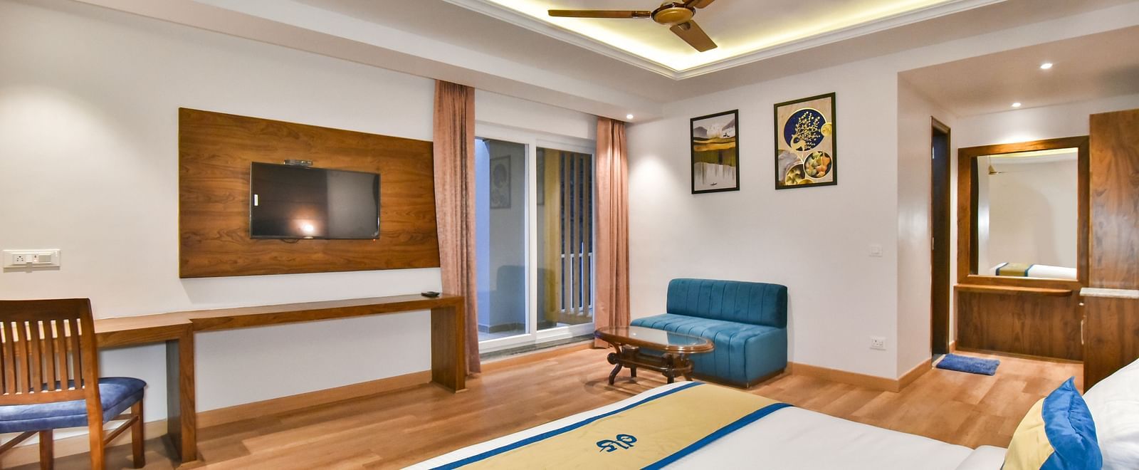 A view of the TV placed in front of the TV in Premium Room With Balcony at DLS Ark Holiday Inn, Banikhet.