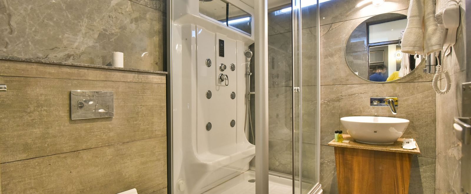 Luxury Room Washroom at DLS Dalhousie Valley Resort featuring a steam bath, sink area  and a toilet.