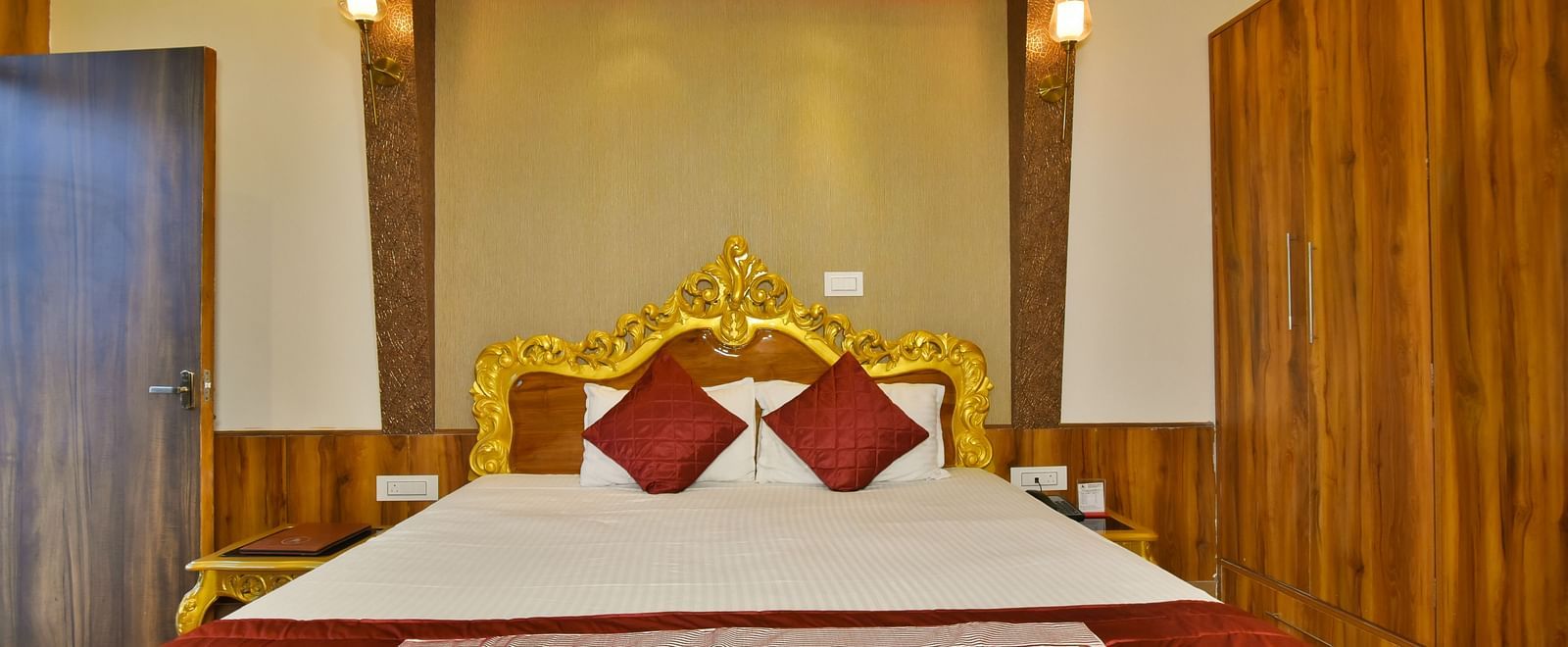 A Luxury Room at DLS Dalhousie  Valley Resort with a premium bed and wardrobe. .