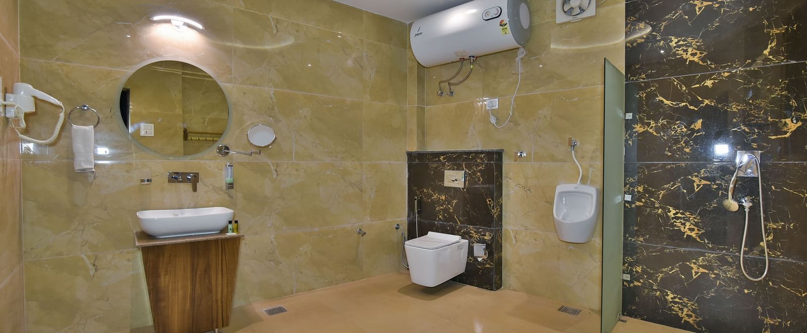 Bathroom of Family Suite at DLS Dalhousie Valley Resort with a sink mirror and a toilet.