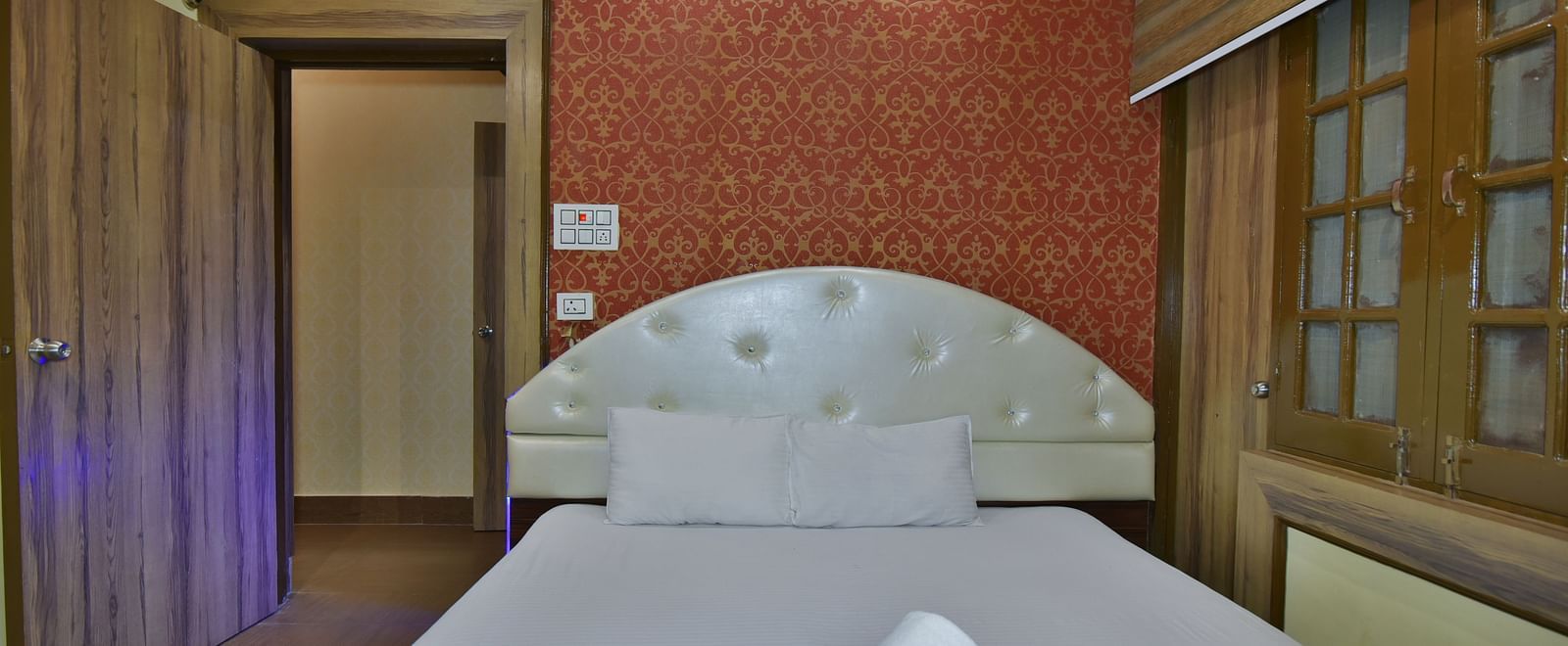 Family Suite at DLS Dalhousie Valley Resort with a king size bed, towels and a door. 