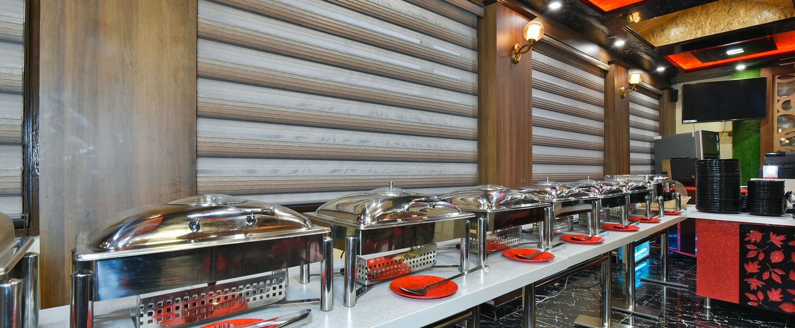 Buffet counter at DLS Dalhousie Valley Resort with various dishes kept on the table.